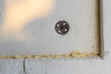 Insulation of the house with styrofoam. Energy saving concept. Closeup