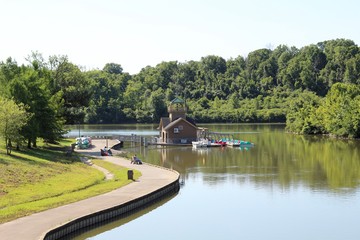 A side view of the boathouse at the lake on a sunny day