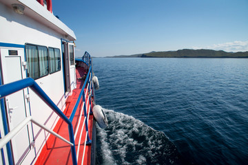 Obraz premium View at lake Baikal and an island from the boat