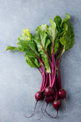Beet, beetroot bunch on grey stone background. Copy space. Top view.