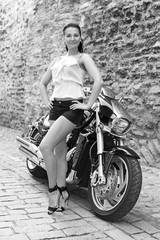 Fototapeta na wymiar girl on a powerful motorcycle