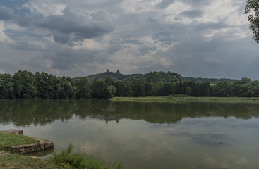Fototapeta premium Trosky castle in summer hot day with pond
