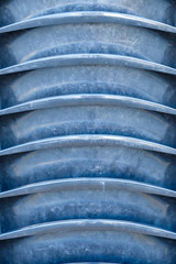 background texture of stacked black dirty plastic chairs