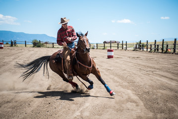 Cowboy Showcasing Barrel Racing Skills on Horseback - obrazy, fototapety, plakaty