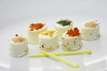 Pieces of fresh french cheese on white plate