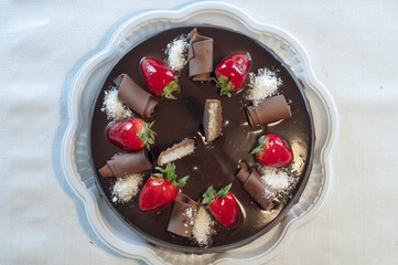 chocolate cake with stuffing and strawberries