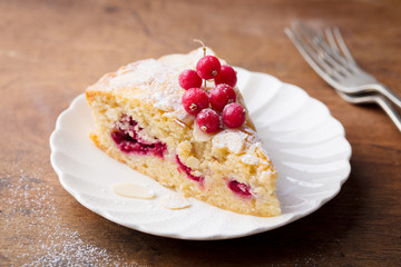 Almond and raspberry cake, Bakewell tart. Traditional British pastry. Wooden background.