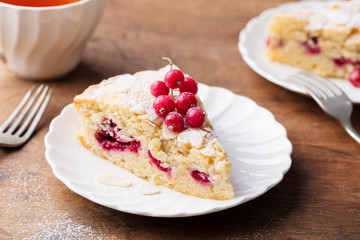 Almond and raspberry cake, Bakewell tart. Traditional British pastry. Wooden background.