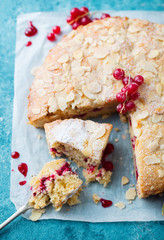 Almond and raspberry cake, Bakewell tart. Traditional British pastry. Blue background. Top view.