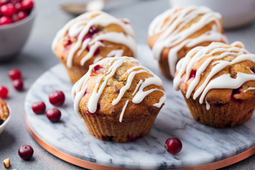Muffins, cakes with cranberry and pecan nuts. Christmas decoration. Close up.
