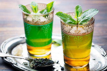 Mint tea, Moroccan traditional drink in glass. Close up.