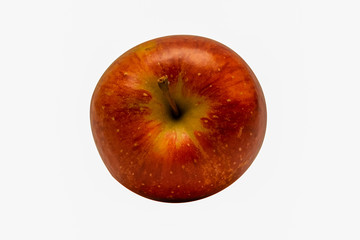 One isolated red apple from above.