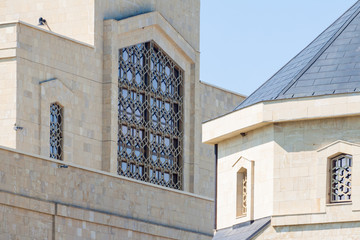 Obraz premium Stone buildings with large and small Windows.