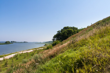 Fototapeta premium The slope of the hill along the river.