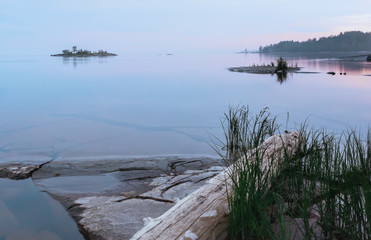 Northern White Night Over The Rocky Islands In The Lake