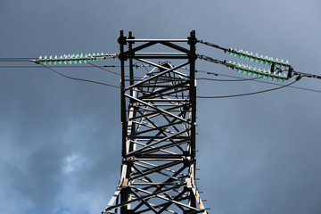 Transmission tower with high voltage wires from below