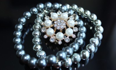 pearl necklace on black background