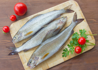 Fresh grayling, a family of salmon. Fresh fish on the table.