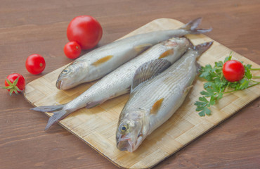 Fresh grayling, a family of salmon. Fresh fish on the table.