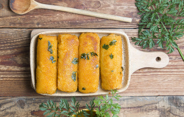 Delicious croquettes on wood