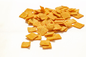 Spicy wheat chips, isolated on a white background. Chinese chips, appetizers.