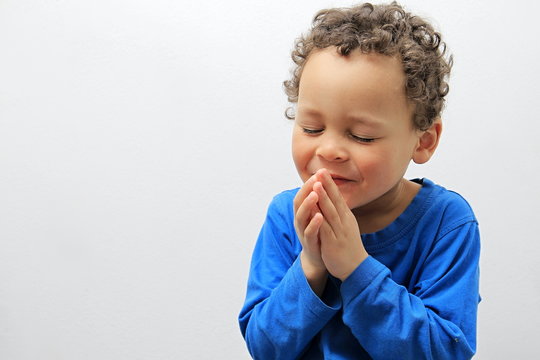 little boy praying