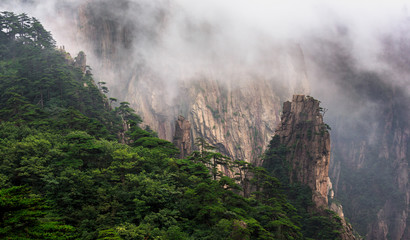 Huangshan China National Park - Anhui Province, Chinese Mountain Peak. Viewing Platform, Yellow Granite Mountains with Canyon, Exotic Pine Trees and Mist, Jagged Cliffs, UNESCO World Heritage Site