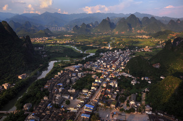 Village of Xingping, Landscape of Guilin, Li River and Karst mountains. Located near Yangshuo, Guilin, Guangxi, China. Small Fishing Village and mountains in the background, aerial view of countryside