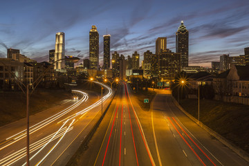 Fototapeta na wymiar Night highway traffic and cityscape skyline in urban Atlanta, Georgia. 