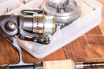 Fishing tackle on wooden blue background