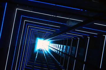 Elevator corridor in the building lit by Blue elumination. Futuristic elevator shaft is located in...