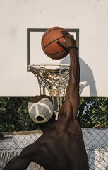 Afro Man Basketball Player In A Street Court