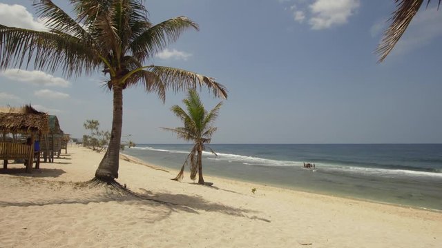 Tropical island with white sandy beach in blue lagoon, palm tree. Patarl white sand beach with turquoise water. Seascape, ocean and beautiful beach. Philippines, Anda, Pangasinan. Travel concept.