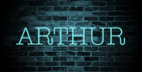 first name Arthur in blue neon on brick wall