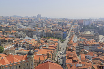 Fototapeta na wymiar Scenic view of Porto, Portugal from the window of the tower. Orange roofs of the houses.