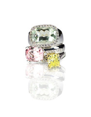 Grouping of colored gemstone diamond rings stacked