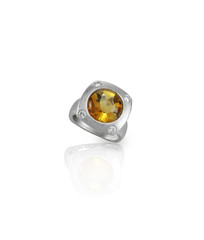 orange amber gemstone and diamond ring isolated on white