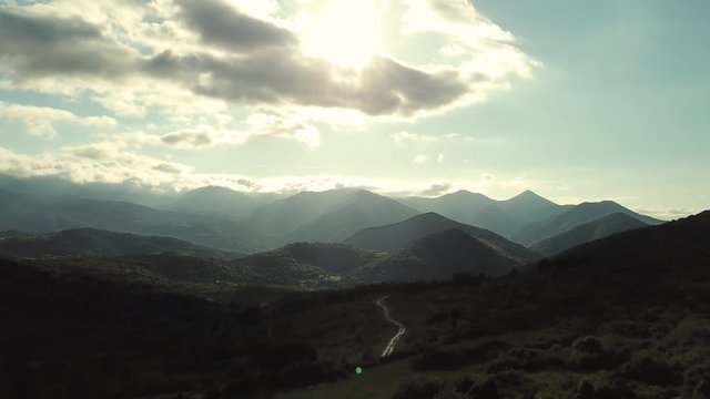 Aerial view of pyrenean mountains with shining sun, Ariege in the southern of France
