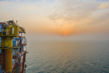 Offshore oil and gas drilling platform or rig, Asia, China. Offshore oil and rig platform in sunset...
