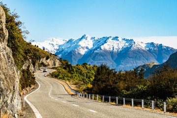 Stunning beautiful view of the road with alps mountain. Noon scenery with some cloudy and blue sky....