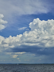 Fototapeta na wymiar Sailboat and clouds 137