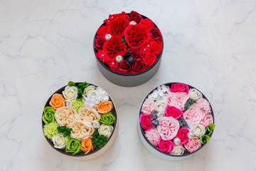 3 round boxes of flower