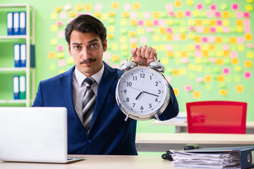 Businessman with many conflicting priorities in time management 