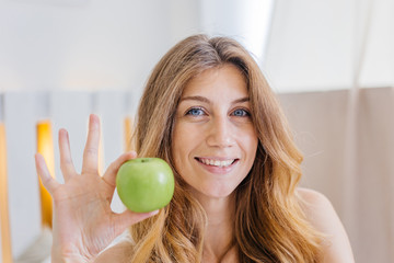 Fototapeta premium Young beautiful woman having breakfast in bed