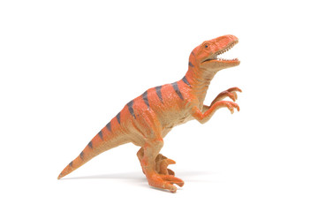 Plastic velociraptor toy isolated on white background