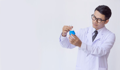 young man scientist in chemistry lab