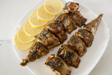 Marinated mackerel slices baked on the grill