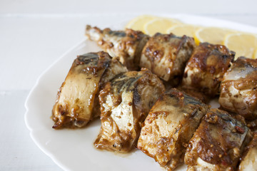 Marinated mackerel slices baked on the grill