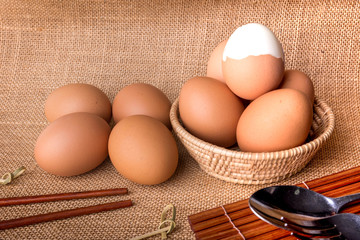 Set Eggs in a basket on  gunny (sackcloth)  background