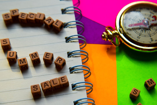 Special summer sale message written on wooden blocks. Vacation and travel concepts. Cross processed image